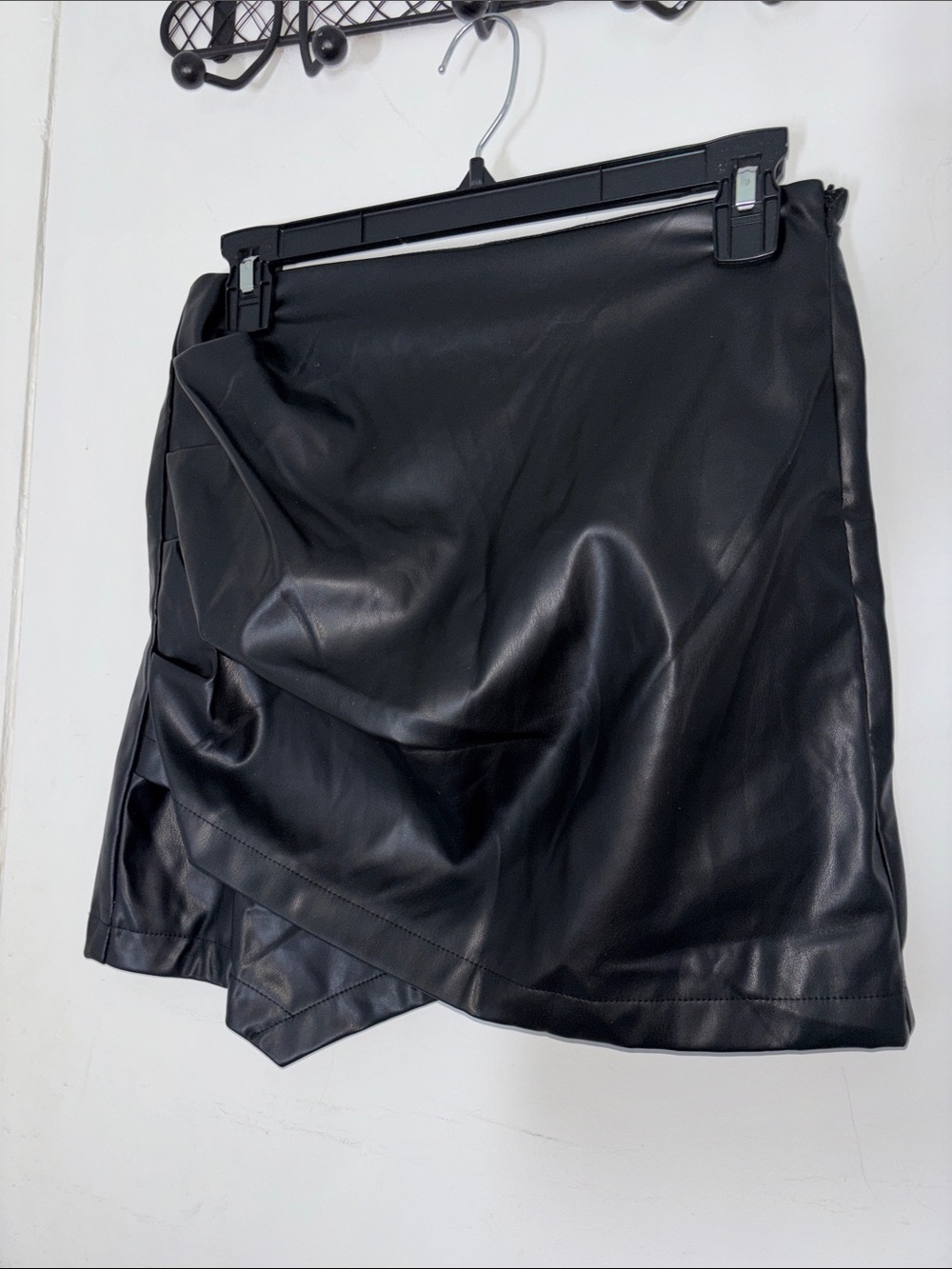 Sleek Black Faux Leather Asymmetrical Mini Skirt